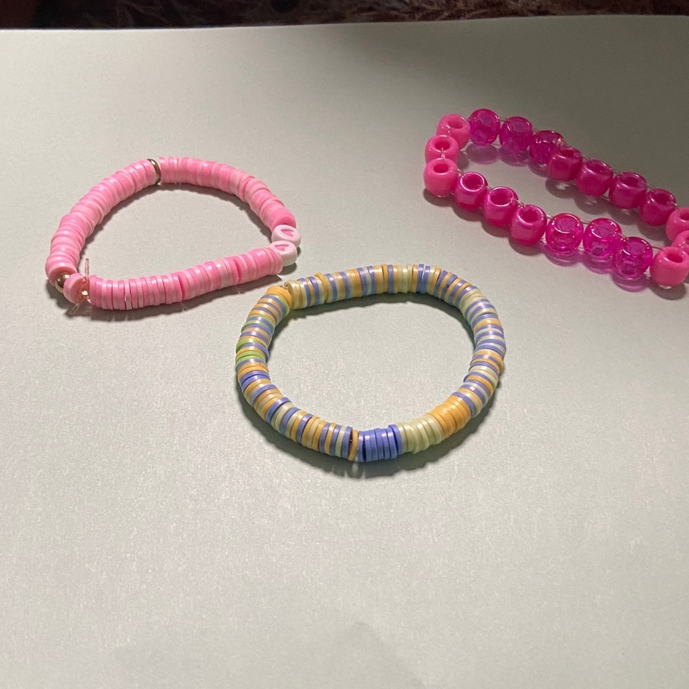 Clay bead bracelets and singular ladder stitch cuff